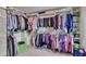 Large walk-in closet with ample storage space and custom shelving is perfect for organizing clothes and accessories at 375 Spindle Ct, Sandy Springs, GA 30350