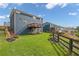 Expansive backyard featuring a wooden deck, lush lawn, and mature landscaping, perfect for outdoor enjoyment at 186 Greenbrier Way, Canton, GA 30114