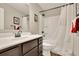 Bathroom featuring a shower over tub and a granite topped vanity at 186 Greenbrier Way, Canton, GA 30114