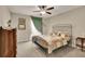Comfortable bedroom with large window, ceiling fan and antique-style furnishings at 186 Greenbrier Way, Canton, GA 30114