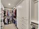 Walk-in closet with custom shelving, drawers, and ample storage space at 186 Greenbrier Way, Canton, GA 30114