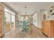 Bright dining area open to kitchen with access to deck through sliding glass door at 186 Greenbrier Way, Canton, GA 30114