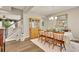 Traditional dining room features a wooden hutch, elegant table setting, and staircase in the background at 186 Greenbrier Way, Canton, GA 30114