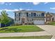 Charming two-story home with a well-manicured lawn and a beautiful stone and siding facade at 186 Greenbrier Way, Canton, GA 30114