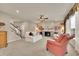 Bright living room showcasing a fireplace, plush seating, and stairs creating a welcoming and open space at 186 Greenbrier Way, Canton, GA 30114