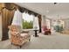 Spacious living room with large windows, comfortable seating, and an open view to the kitchen at 186 Greenbrier Way, Canton, GA 30114