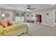 Bright and spacious main bedroom with neutral colors, plush carpet, and large windows at 186 Greenbrier Way, Canton, GA 30114