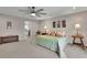 Spacious main bedroom with neutral colors, plush carpet, and decorative lamps at 186 Greenbrier Way, Canton, GA 30114