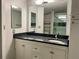 Updated bathroom with dark countertops, a vanity, and a walk-in shower at 199 14Th Ne St # 710, Atlanta, GA 30309