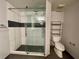 Bathroom featuring a glass-enclosed shower and shelving at 199 14Th Ne St # 710, Atlanta, GA 30309