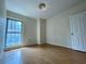 Cozy bedroom with hardwood floors, natural light, and a classic white door at 199 14Th Ne St # 710, Atlanta, GA 30309