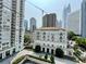 Apartment buildings in an urban setting showcase classic architectural style and manicured landscaping at 199 14Th Ne St # 710, Atlanta, GA 30309