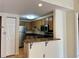 Kitchen with stainless appliances, granite counters, wood cabinets and open serving area at 199 14Th Ne St # 710, Atlanta, GA 30309