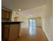 Open-concept living room with hardwood floors, built-in cabinet, slider doors, and chandelier at 199 14Th Ne St # 710, Atlanta, GA 30309