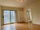 Bright living room featuring a sliding glass door with city views and a built-in storage cabinet at 199 14Th Ne St # 710, Atlanta, GA 30309