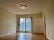 Bright living room with wood floors, a decorative chandelier and built in storage cabinets at 199 14Th Ne St # 710, Atlanta, GA 30309