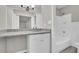 All white bathroom featuring a single sink with granite countertops and a shower and tub combo at 2551 Park Se Rd, Smyrna, GA 30080