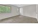 Bright bedroom featuring soft carpet, natural light from windows, and ample closet space at 2551 Park Se Rd, Smyrna, GA 30080