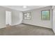 Cozy bedroom with neutral carpet, large windows, and a ceiling fan for comfort at 2551 Park Se Rd, Smyrna, GA 30080