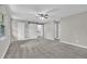 Spacious bedroom with large windows, cozy carpet, and modern sliding barn door at 2551 Park Se Rd, Smyrna, GA 30080