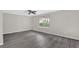 Bedroom features a ceiling fan, hardwood floors, white trim and one large window at 2551 Park Se Rd, Smyrna, GA 30080