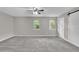 Large bedroom with soft carpet, plenty of light from windows, and barn door access at 2551 Park Se Rd, Smyrna, GA 30080