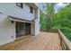 Wooden deck featuring sliding glass door access to the home, perfect for outdoor relaxation at 2551 Park Se Rd, Smyrna, GA 30080