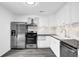 Well-equipped kitchen with stainless steel appliances, white cabinets, and ample counter space at 2551 Park Se Rd, Smyrna, GA 30080