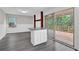 Bright kitchen boasts white cabinets, granite countertops, and sliding door access to the deck at 2551 Park Se Rd, Smyrna, GA 30080