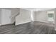 Living room features hardwood floors, white trim, fan and a large opening to the kitchen at 2551 Park Se Rd, Smyrna, GA 30080