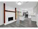 Open-concept living space with a fireplace, kitchen, and access to the outdoors at 2551 Park Se Rd, Smyrna, GA 30080