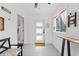 Bright entryway with a bench, light gray flooring, and natural light at 428 Tibbetts Se St, Marietta, GA 30060