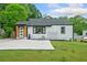 Charming home featuring a well-maintained lawn and a concrete driveway at 428 Tibbetts Se St, Marietta, GA 30060