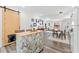 Modern kitchen and dining area with an island, seating, and an open layout at 428 Tibbetts Se St, Marietta, GA 30060