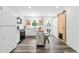 Modern kitchen featuring white cabinets, stainless appliances, and an island with seating at 428 Tibbetts Se St, Marietta, GA 30060
