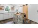 Bright kitchen featuring white cabinets, stainless appliances, and an island with seating at 428 Tibbetts Se St, Marietta, GA 30060