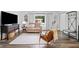 Cozy living room with a loveseat, leather chair, TV, and stylish decor at 428 Tibbetts Se St, Marietta, GA 30060
