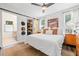 Serene main bedroom with wood accents, sliding barn door, and stylish decor at 428 Tibbetts Se St, Marietta, GA 30060