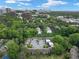 Aerial view showcasing residential community surrounded by mature trees and access to nearby city amenities at 95 Ivy Ne Trl, Atlanta, GA 30342