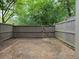 Enclosed backyard with a stone patio and wooden fence, offering a private outdoor space at 95 Ivy Ne Trl, Atlanta, GA 30342