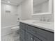 Updated bathroom features white subway tile, shower, tub, and vanity with modern fixtures at 95 Ivy Ne Trl, Atlanta, GA 30342