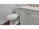 Bathroom with white cabinets, toilet, and marble countertop at 95 Ivy Ne Trl, Atlanta, GA 30342