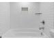 Subway tile and built in shelf featured in shower and bath at 95 Ivy Ne Trl, Atlanta, GA 30342