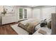 Bedroom with laminate flooring, walk-out doors, and closet at 95 Ivy Ne Trl, Atlanta, GA 30342