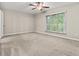 Spacious bedroom with a large window and ceiling fan at 95 Ivy Ne Trl, Atlanta, GA 30342