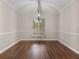 Well-lit dining area showcasing modern light fixture and an exterior view at 95 Ivy Ne Trl, Atlanta, GA 30342
