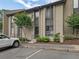 Exterior view of townhome with tidy landscaping and parking at 95 Ivy Ne Trl, Atlanta, GA 30342
