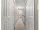 Hallway with white doors and carpet at 95 Ivy Ne Trl, Atlanta, GA 30342