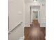 Hallway with hardwood floors leading to bright room with window at 95 Ivy Ne Trl, Atlanta, GA 30342