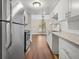 Bright kitchen featuring stainless steel appliances and white cabinets at 95 Ivy Ne Trl, Atlanta, GA 30342